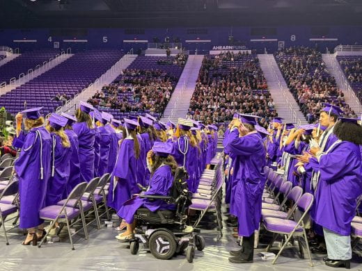 students move tassels to left
