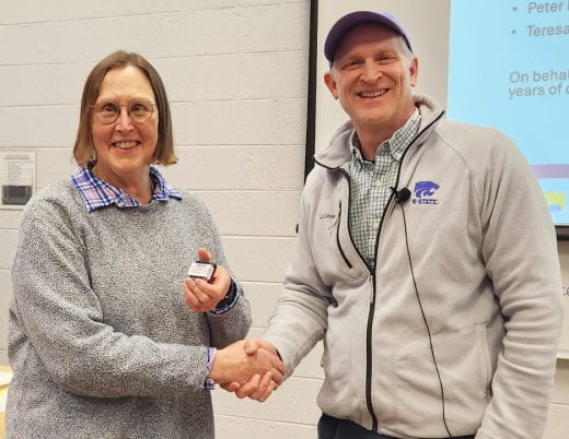 Ruth Welti receives 40-year pin from Dean Chris Culbertson in February 2026