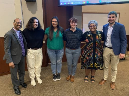 Dean Kimathi Choma poses with students who presented at Student Diversity Summit 2023