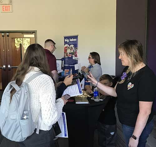 photo of student and smiling exhibitor