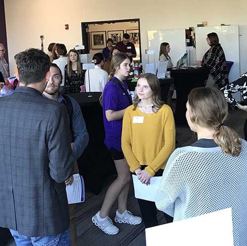 photo of students and exhibitor at Helping Professions Networking Night