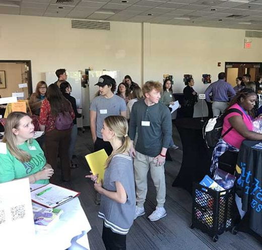 photo of students and exhibitors at Helping Professions Networking Night
