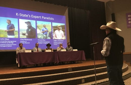 photo of Hot Times event panelists and audience member at microphone