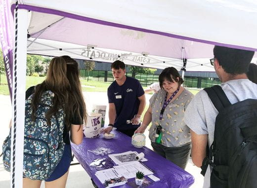 students scooping ice cream at ice cream social