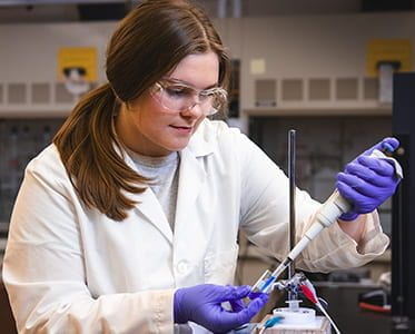 Photo of Erin Frenk working in lab
