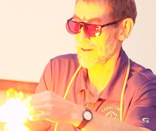 photo of glassblower and flame
