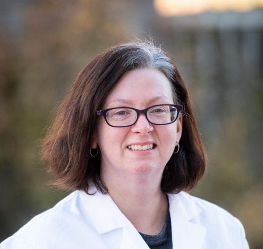 photo of Jocelyn McDonald in lab coat outdoors
