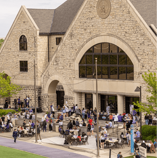 photo of north side of alumni center with people gathered outside