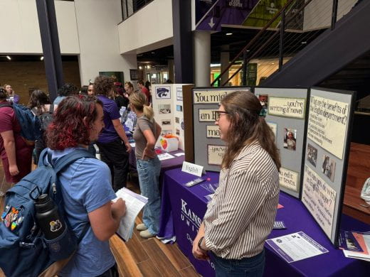 English dept rep talks to student at 2025 Arts and Sciences Discovery Expo