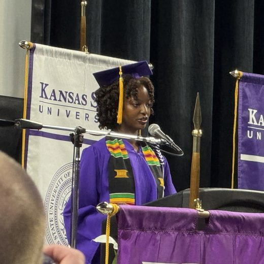 Graduating senior Tinashe Sekabanja delivers speech at podium