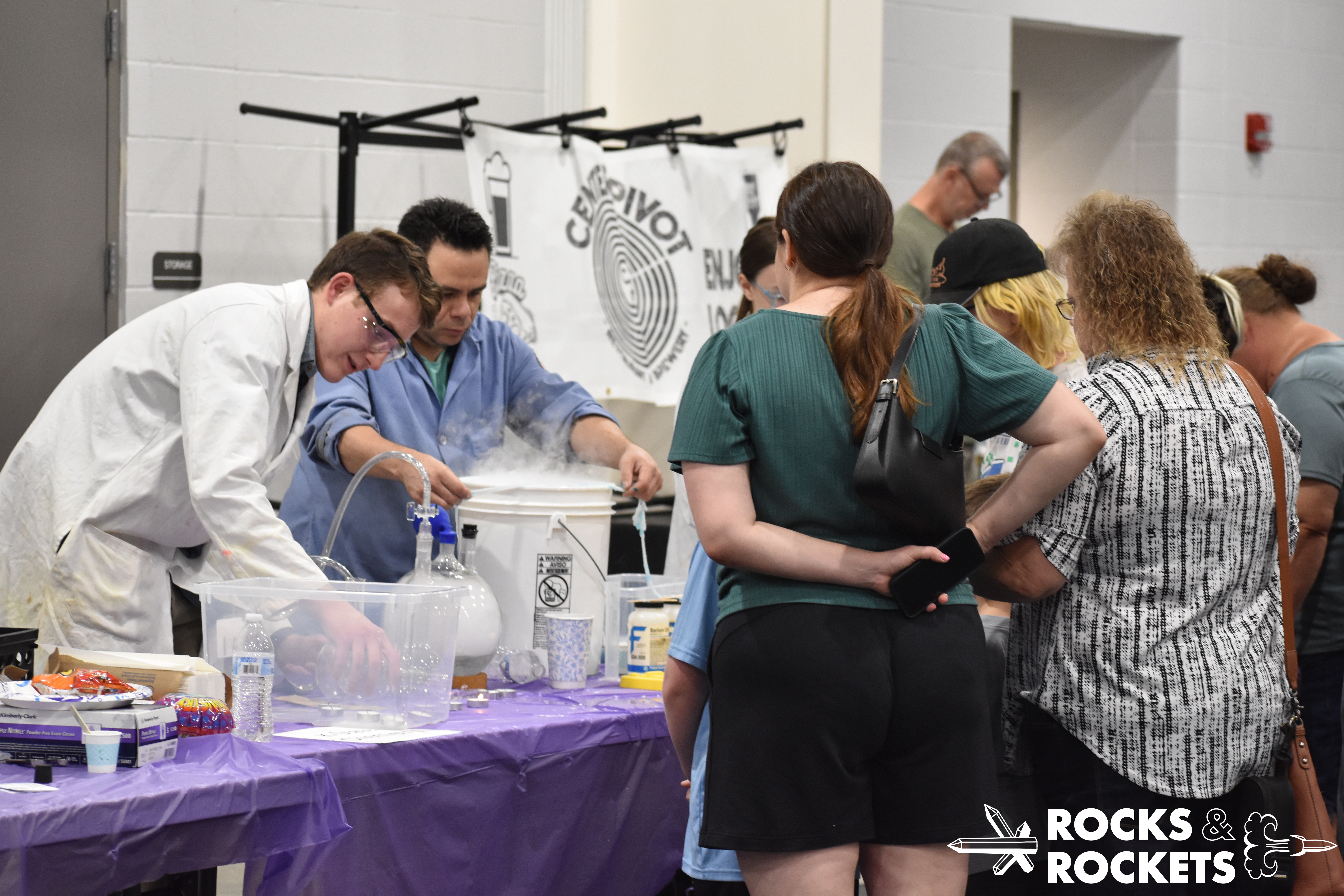 educators and participants interact at chemistry display