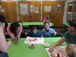 Haley Hermes assisting during a class.