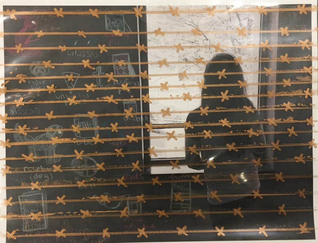 behing the barbed wire