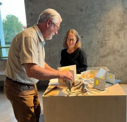 "Mise-en-Scène," 2023 Beach Museum of Art Gift Print at the interactive station of the exhibition "wood+paper+box in your hands."