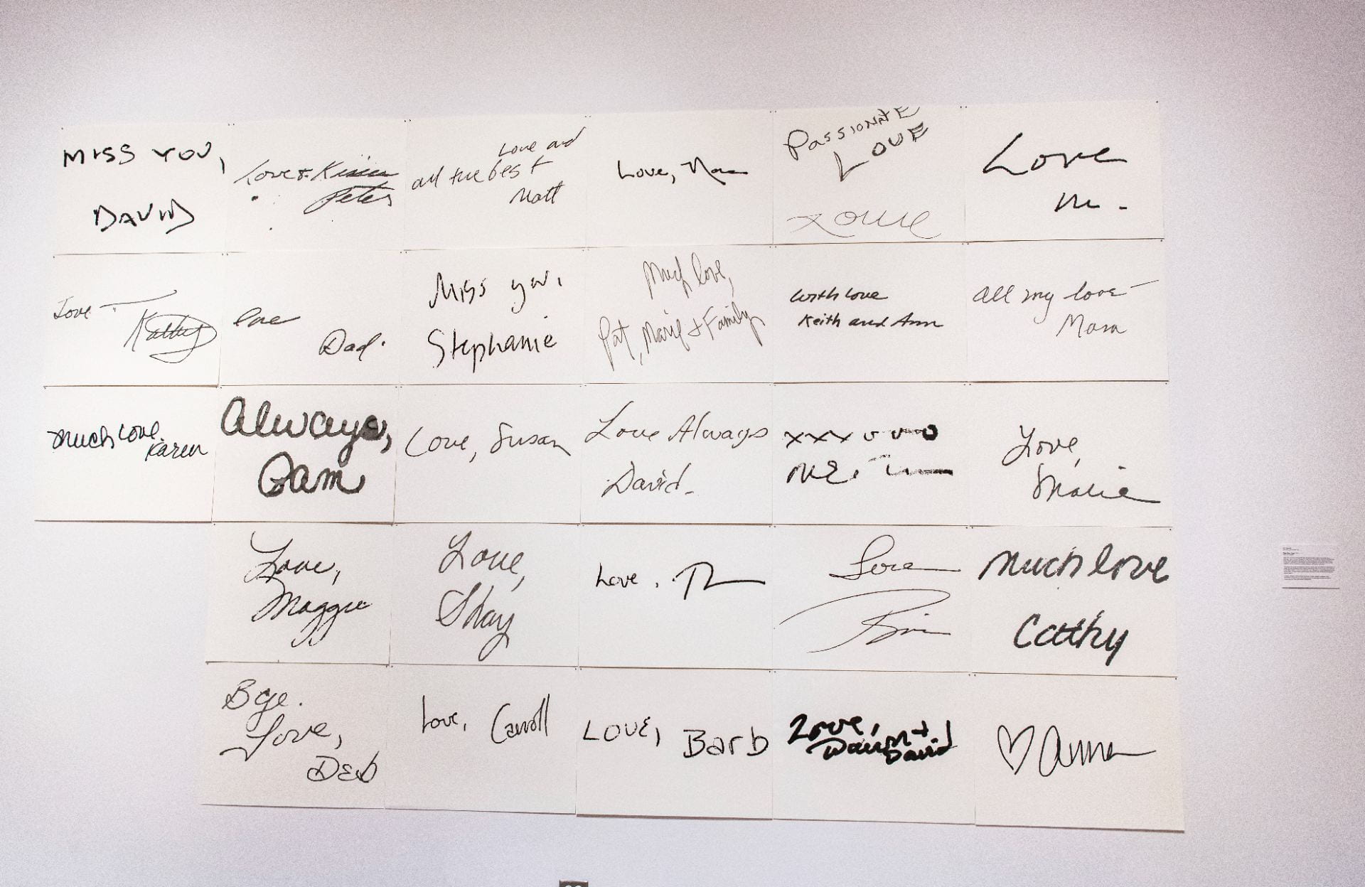 "Dear Ann, Love" work by Ann Resnick showing hand written greetings like "Miss you, David," "much love, Karen" and others. On view in the "Kansas Triennial 25/26" at the Beach Museum of Art.
