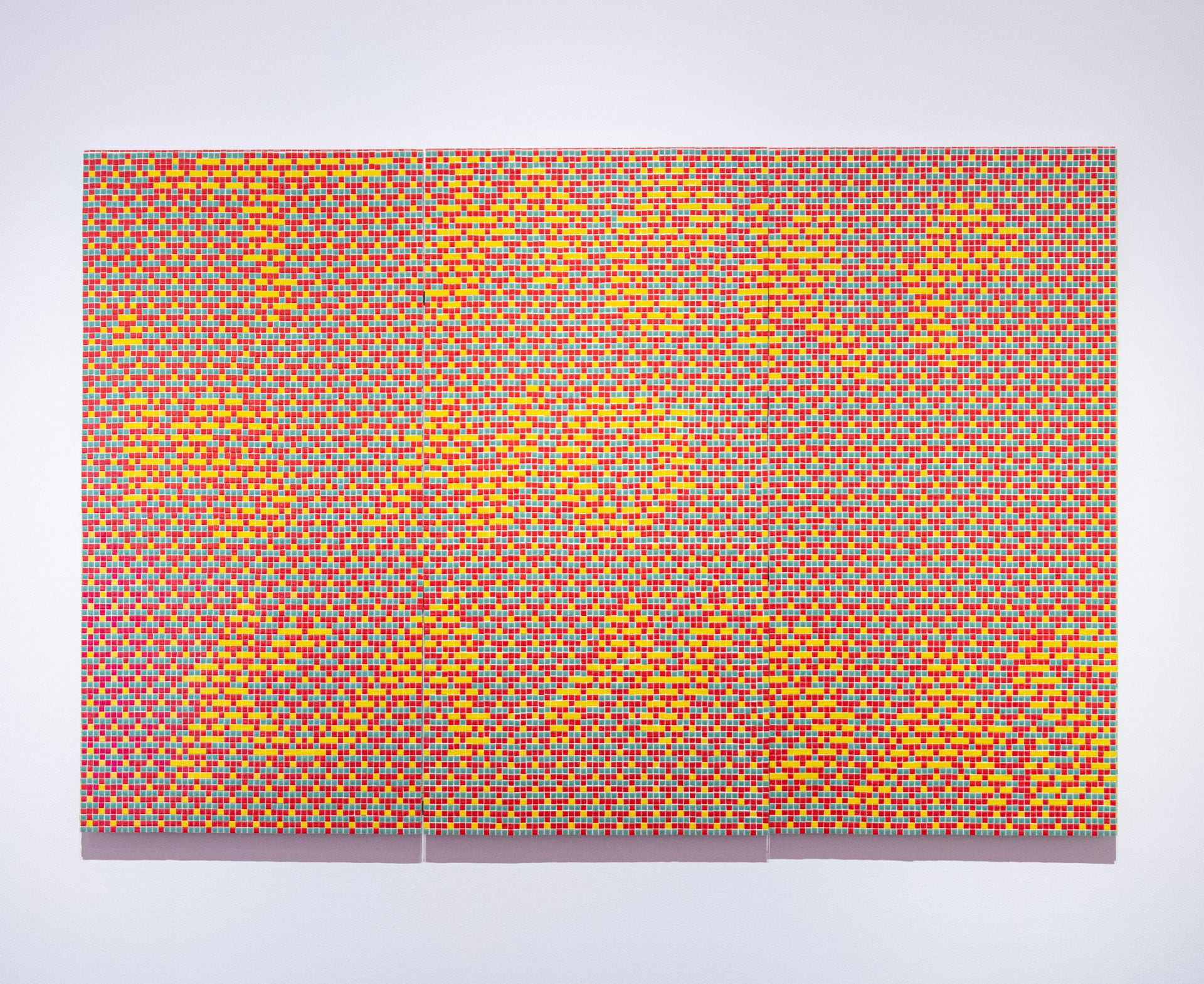 "There is no Kansas" text created with ceramic tiles: artwork by Poppy DeltaDawn, on view in the "Kansas Triennial 25/26" exhibition.