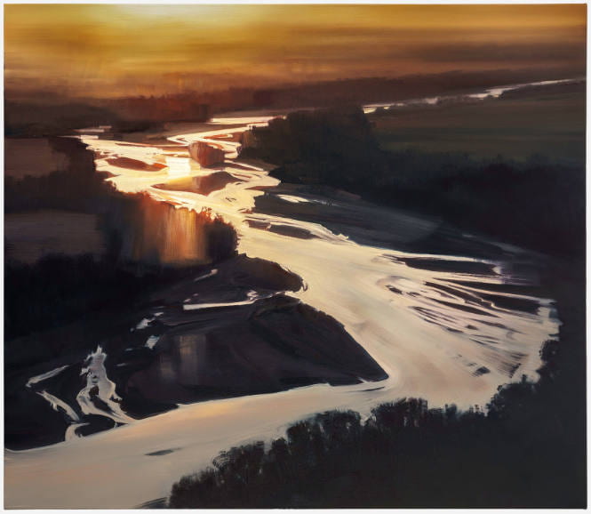 River with land around it and sky at dusk.