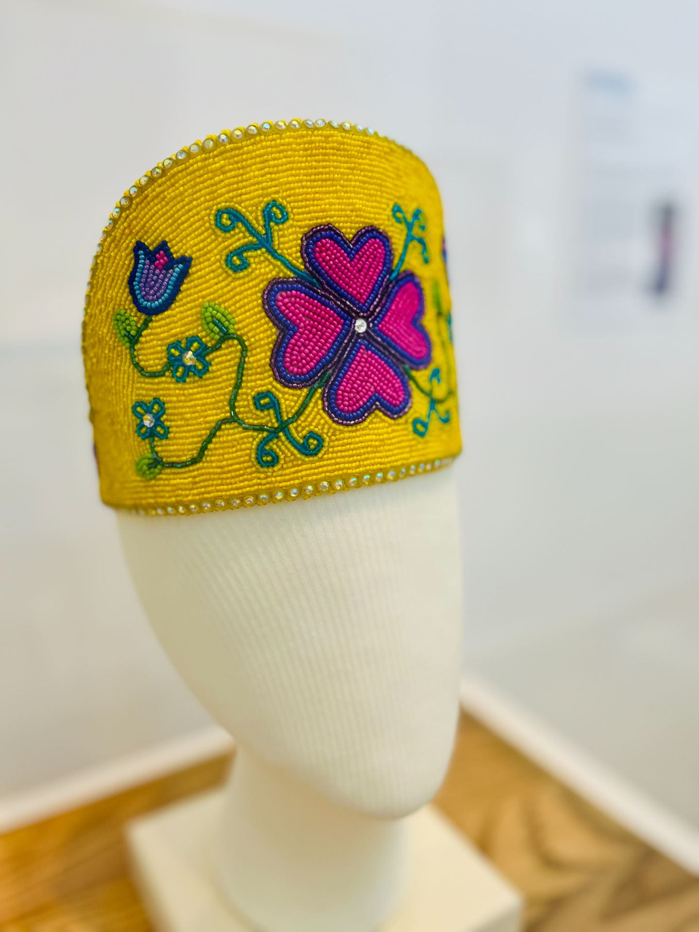A beaded crown with floral patterns.
