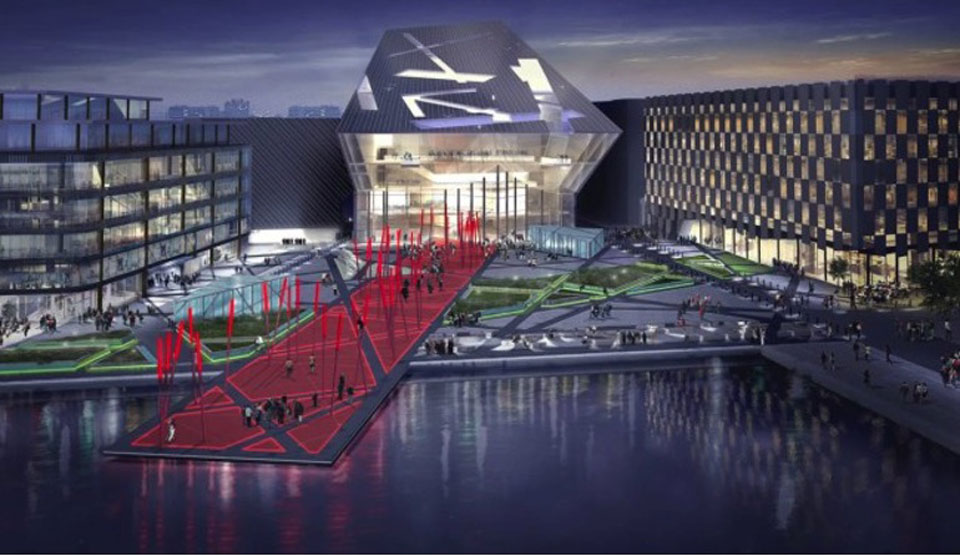 A building illuminates at night 