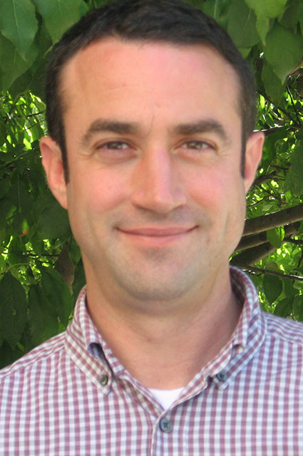 Gabe Kerr smiles for a portrait.