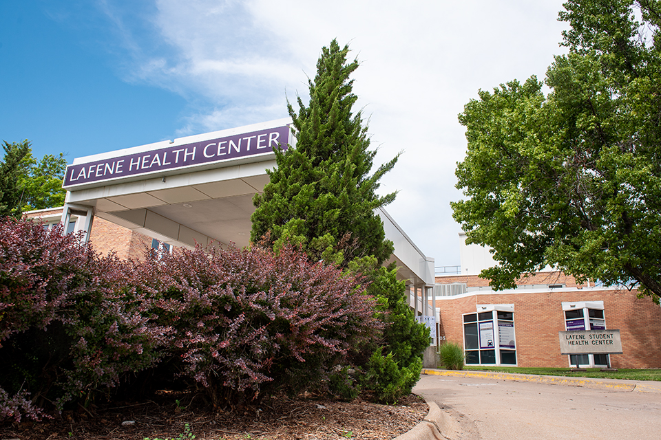 A building awning with the sign "LAFENE HEALTH CENTER" juts out over a driveway.