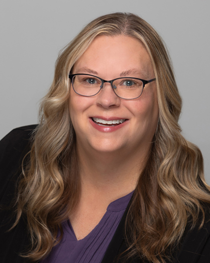Alysia Starkey smiles for a portrait.