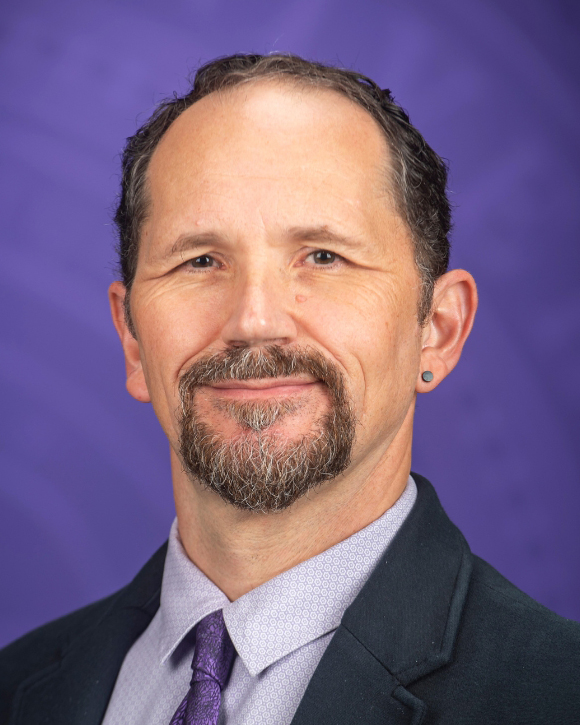 Darrin Smith smiles for a portrait.