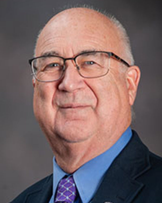 Stephen Higgs smiles for a portrait.