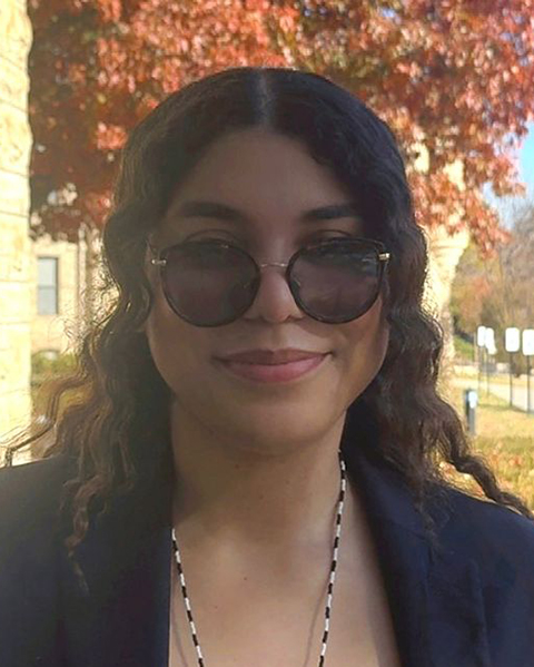 Maria Ramirez Quimbayo smiles for an outdoor portrait.