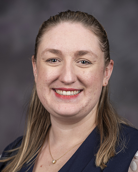 Parker Poulos smiles for a portrait.