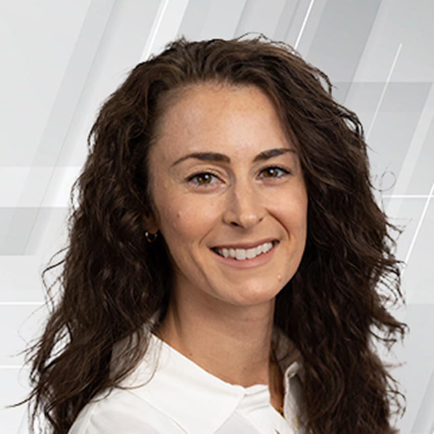 A woman smiles for a portrait.