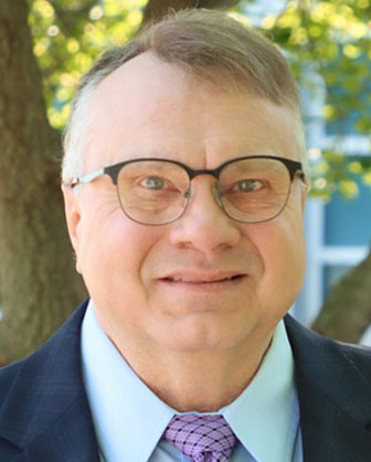 Portrait of Tim Bower in business attire 