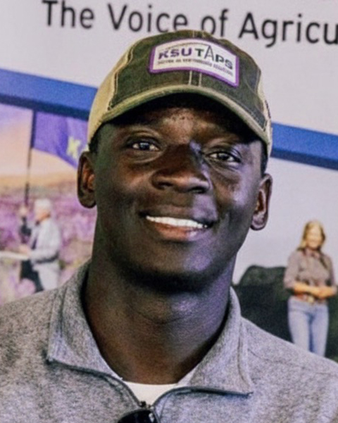 Rayhaan Kabenge smiles for a portrait.