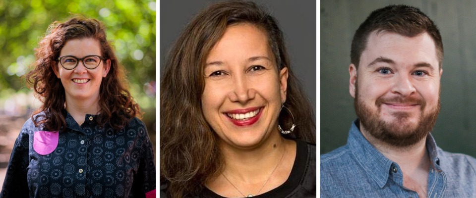 Two people with long hair and one person with short hair smile for portrait images 