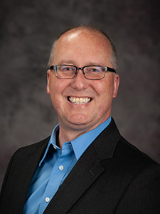 Ryan Rafferty smiles for a portrait. 