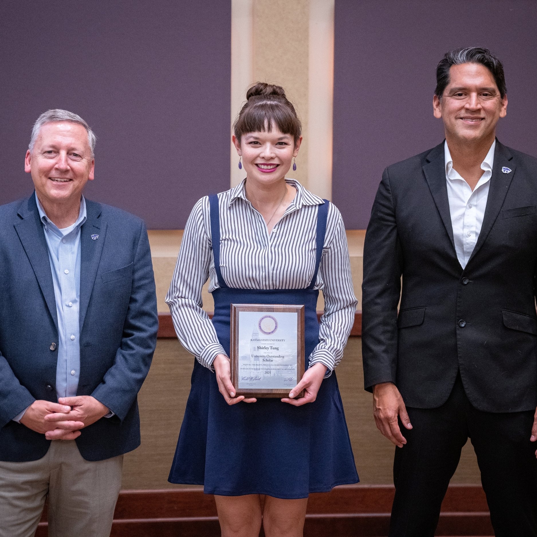 Shirley Tung poses with president Richard Linton and provost Jesse Perez Mendez during K-State's 2025 University Outstanding Scholars ceremony.