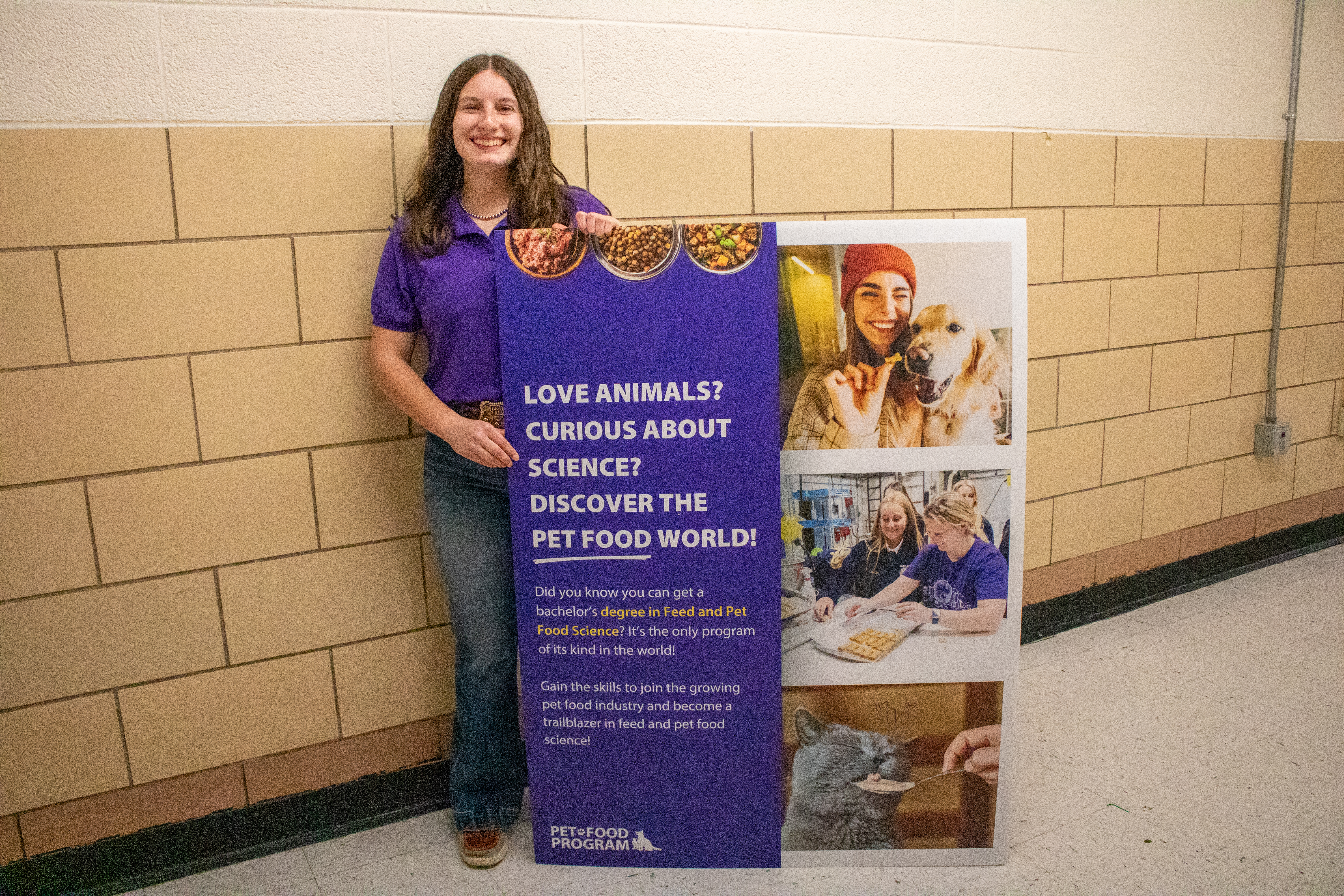 Kennedy Coffin stands next to a research poster. 