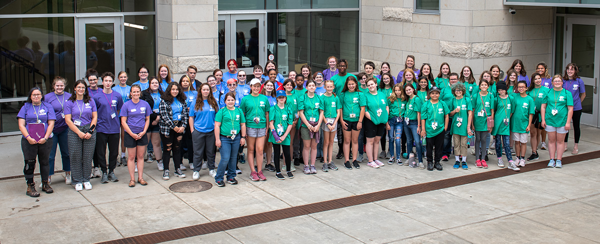 A group of middle and high school students participate in a KSU workshop and gather for a group photo