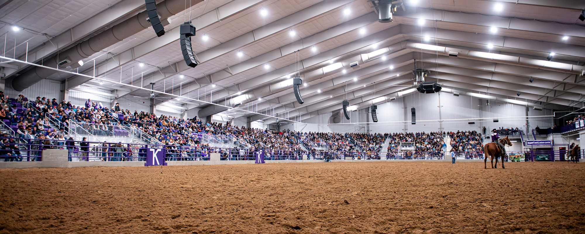 full attendance at a Bilbrey Family Event Center with a horse in the center