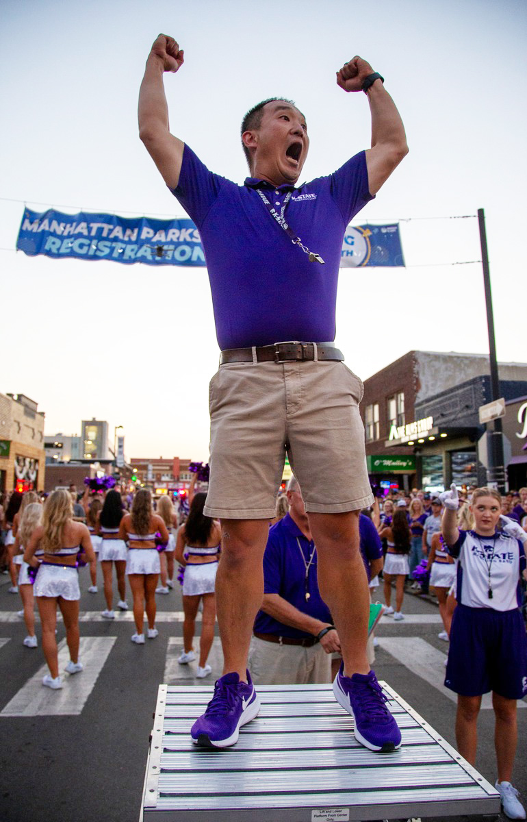 Alex Wimmer on a town street during a marching band parade. 