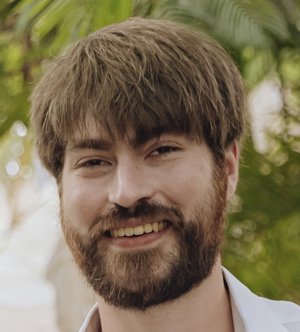 Grant smiles for a portrait 