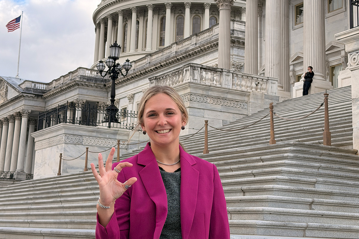 Erin Driscoll stands in front of the Capitol in Washington, D.C., on a sunny day.