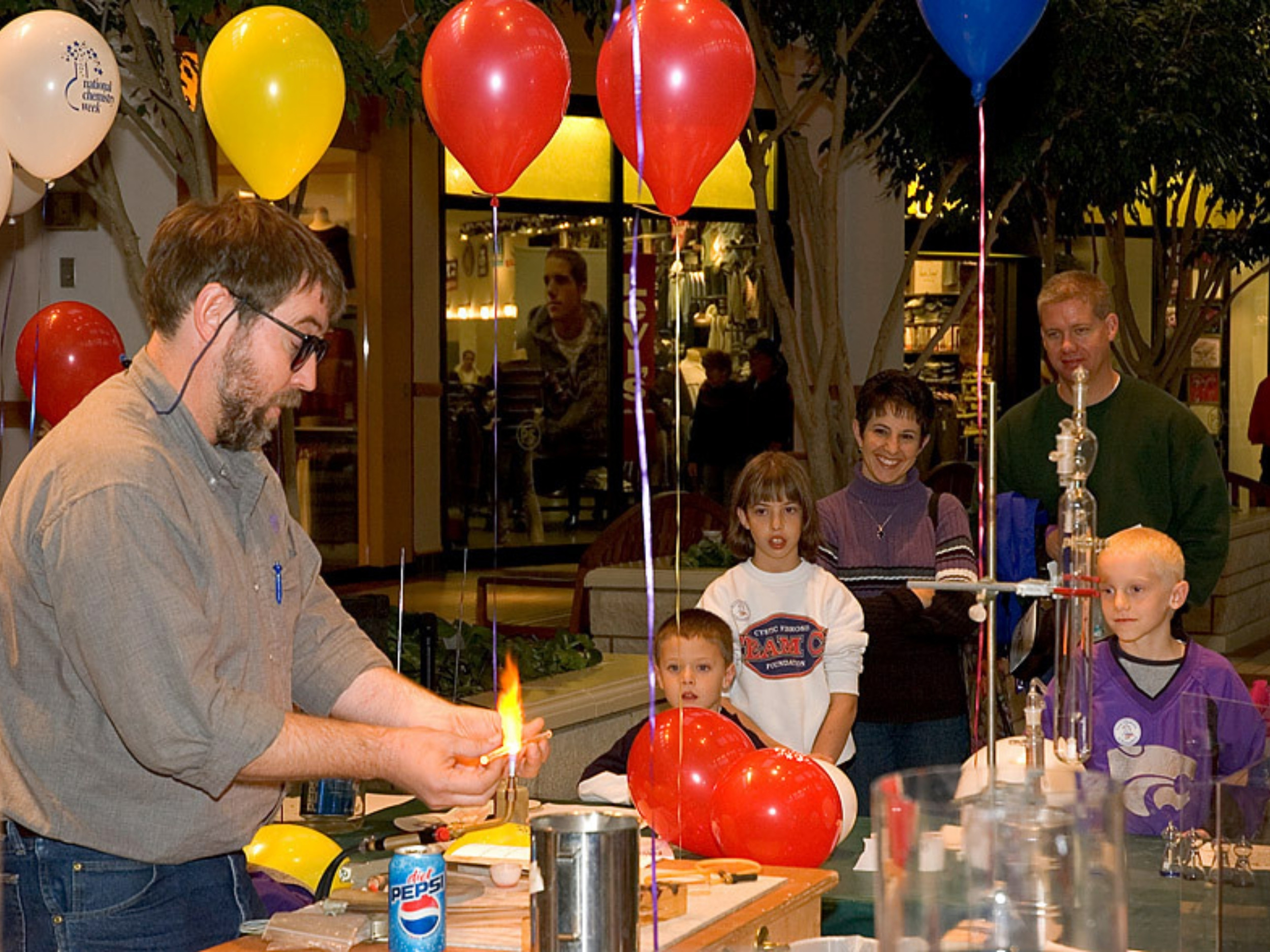 Jim Hodgson showcases his glassblowing skills with a bench burner during the 2006 K-State Open House