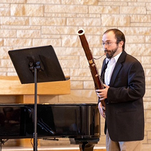 Thomas Stark performs the bassoon at a concert.