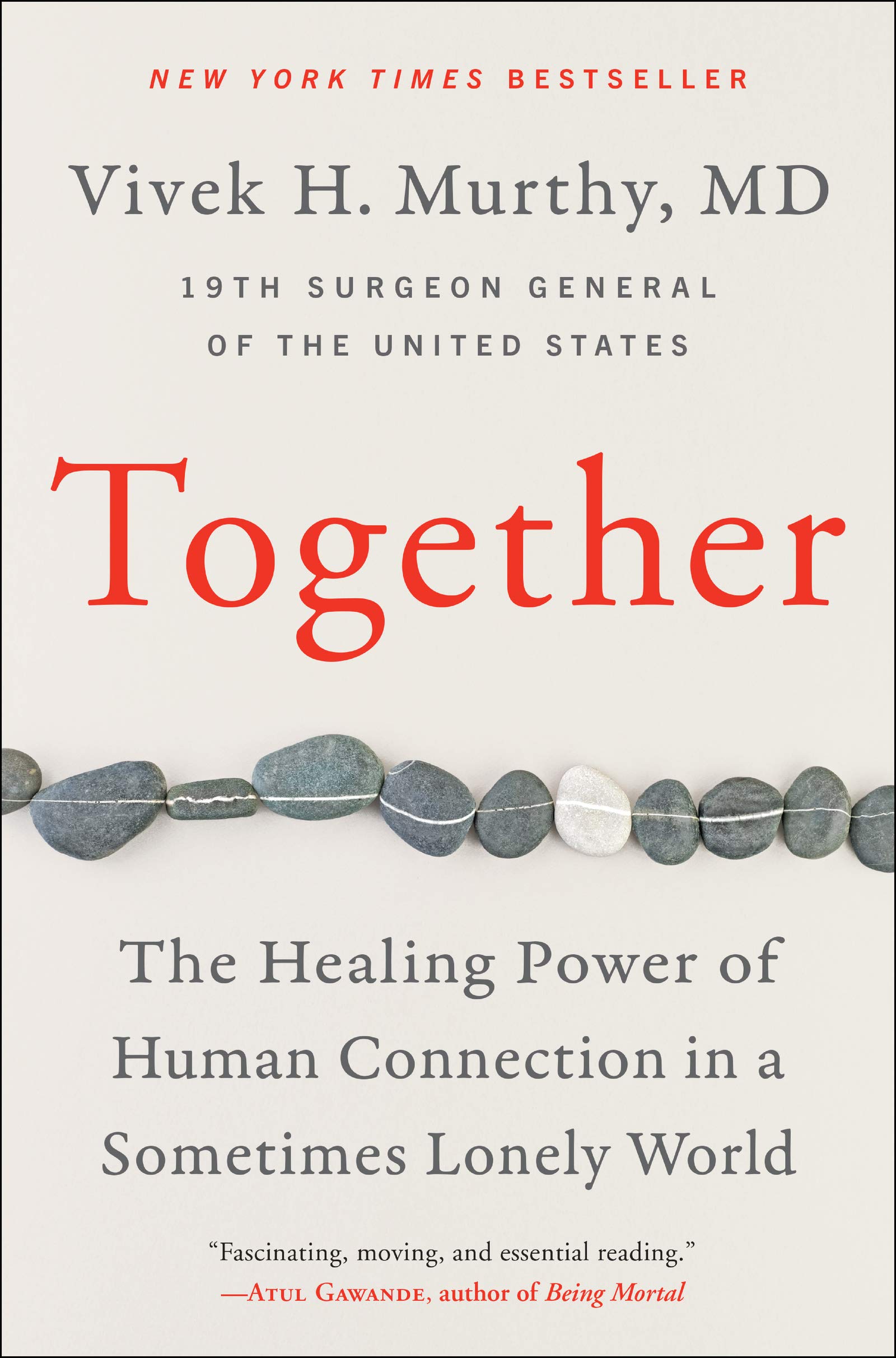 The book cover of "Together" by Vivek H. Murthy. A white book with stones pictured across the middle of the cover and red and gray text.