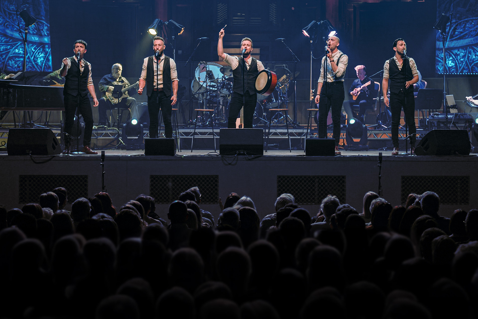 Men singing on stage 