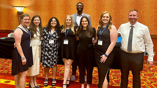 A group of K-State Salina representatives in dress clothes at a banquet