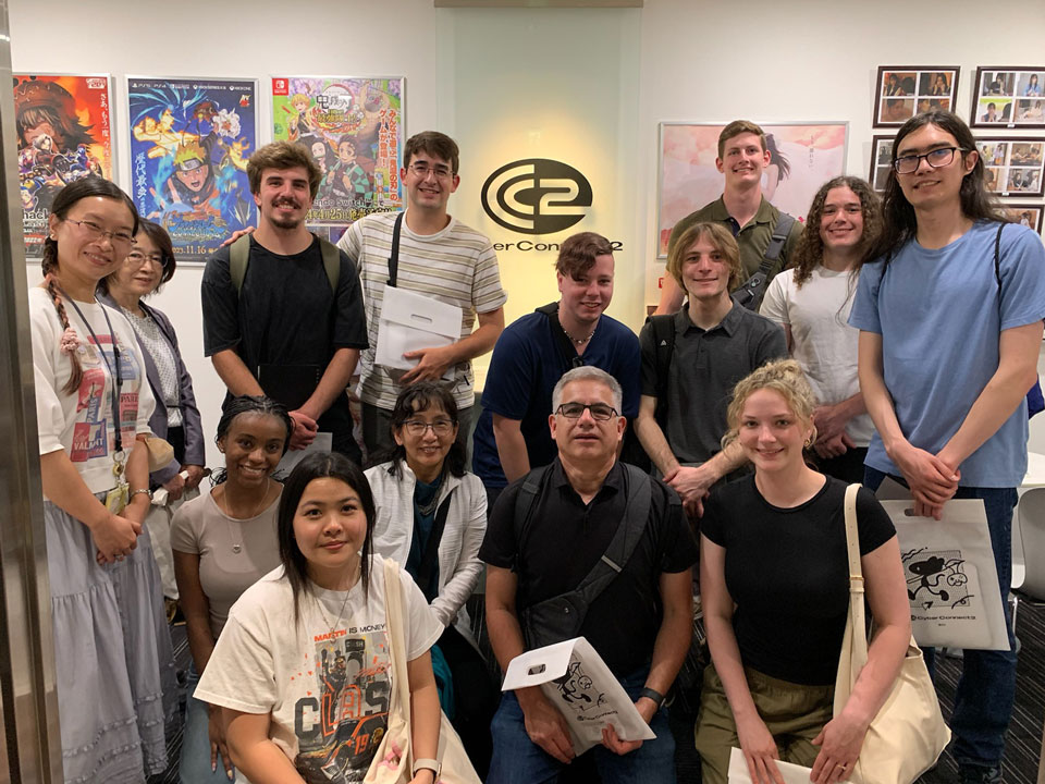 A group of people pose for photo