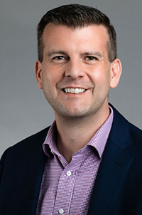 James Wiser wearing purple shirt