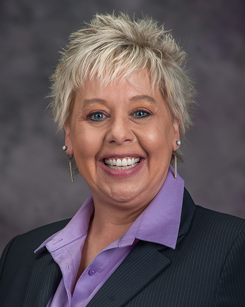 Audrey Taggart-Kagdis smiles for a portrait.